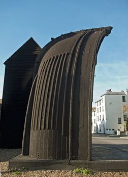 An old boat that has been converted to one of the unique fish net drying huts in Hastings, England
