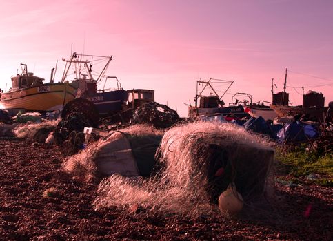 Fishing fleet at Hastings, England waiting on the beach for dawn