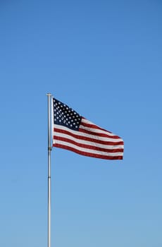 An American flag blowing in the wind