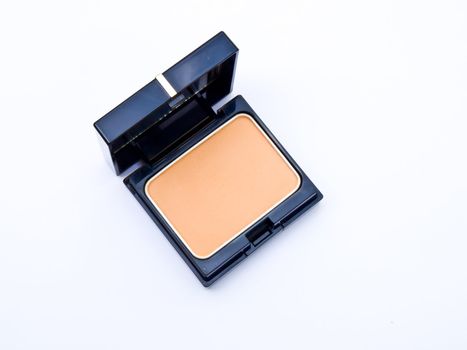 Face powder in a black box isolated in a white background