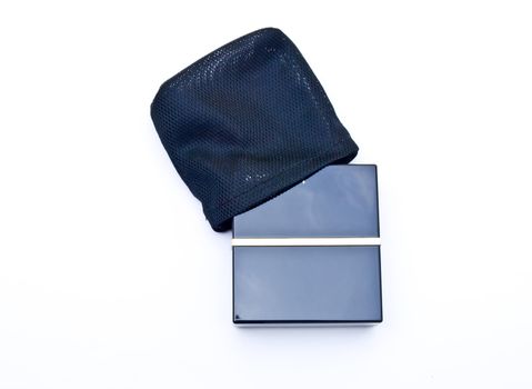 Face powder in a black box and pouch isolated in a white background