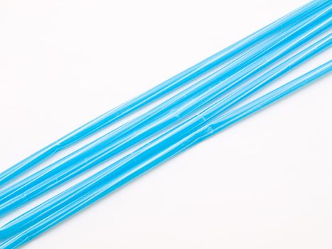 Light blue straws isolated on white back ground