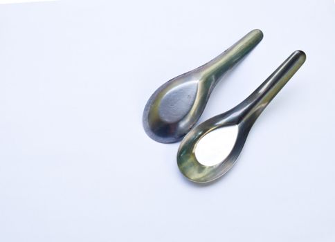 Used stainless stell spoons isolated on white background