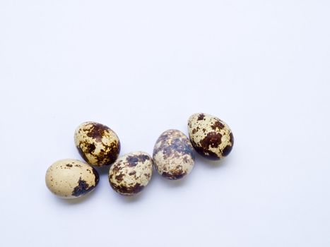 Quail eggs isolated on white background