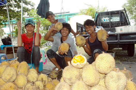 TARAKAN, INDONESIA -  FEB 28, 2012 : portrait of young fruit seller on February 28,  2012 at Tarakan city, Indonesia