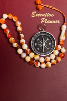 executive planner with rosary beads in portrait orientation