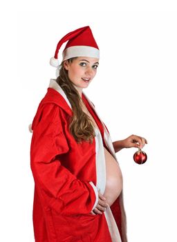 Christmas pregnant girl in santa suit holding red ornament ball