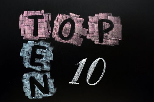 Crossword of Top Ten drawn in chalk on a blackboard