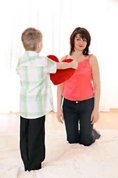 A child gives his mother the gift