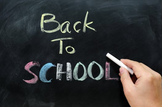 Chalkboard Background with a handwriting of "back to school"