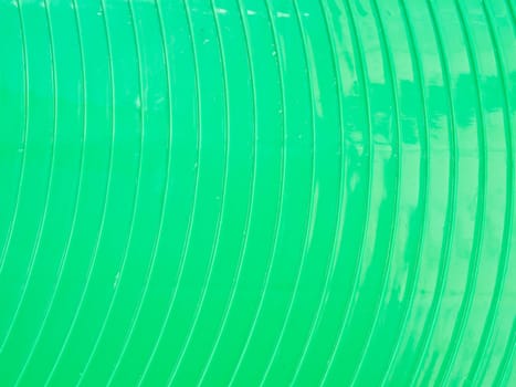 Curved green plasstic as background