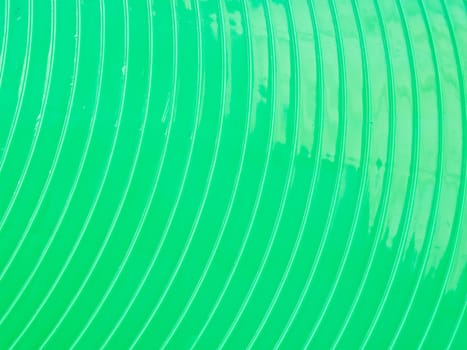 Curved green plasstic as background
