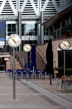 Architecture and clocks in the Canary Whalf area in London, United Kingdom