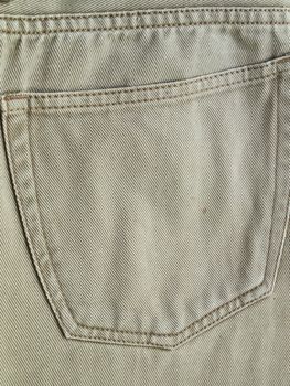 Close up back pocket on khaki jean pants