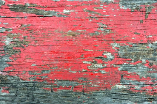 old wooden wall with the paint worn and crusty