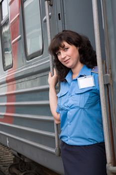 The beautiful girl a conductor of the carriage