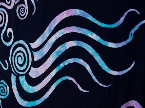 Colorful pattern on black fabric batik as background