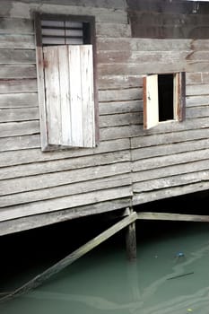 old wooden windows in the house of the periphery