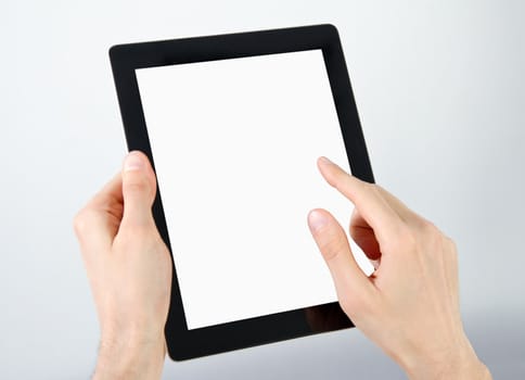 Man hands holding and point on electronic tablet pc with blank screen.