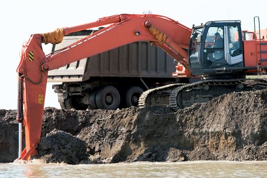 Dredge and the lorry on a background of sky