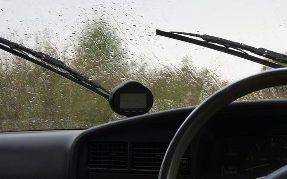 Rain drops on glass of the automobile