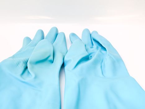 Two light blue rubber gloves