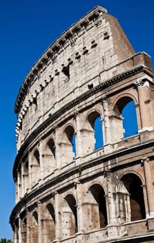 Colosseum in Rome with blue sky, landmark of the city