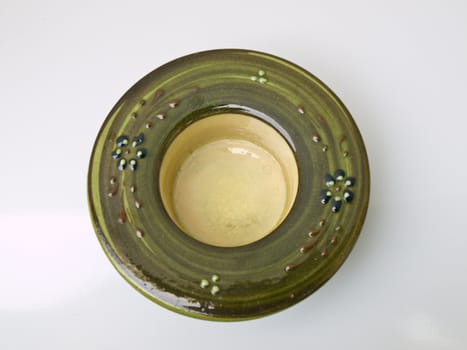 A green ceramic candle handle Handmade from Lampang, the North of Thailand