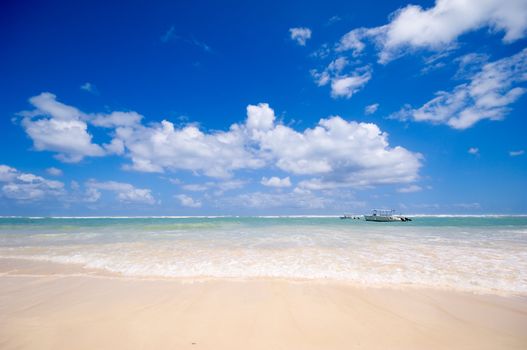 Exotic beach with waves washing in. Dominican Republic.