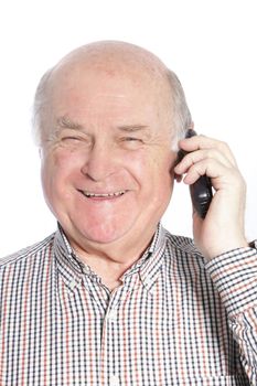 Senior man laughing while talking on mobile phone, portrait