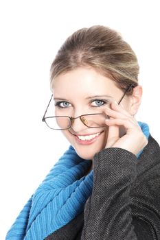 Smiling Caucasian woman holding her glasses in a close up portrait