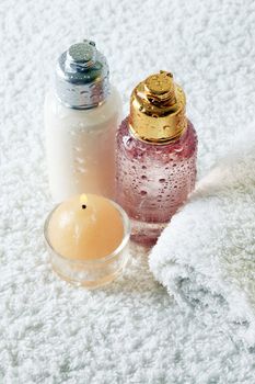 Bodycare products and burning candle