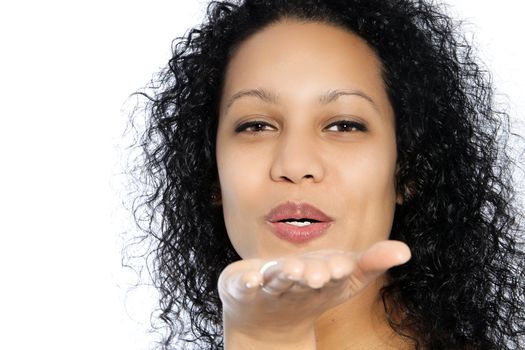 African woman blowing something from her hand