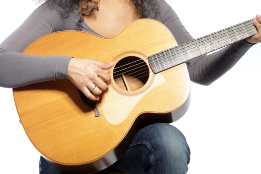 Close up shot of unrecognizable woman playing guitar