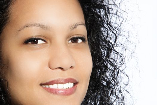 Portrait of beautiful black haired girl smiling