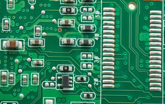 Green circuit board with components