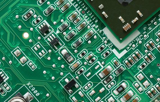 Green circuit board with components