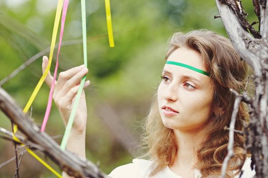 Beautiful girl with ribbons. Early morning photo