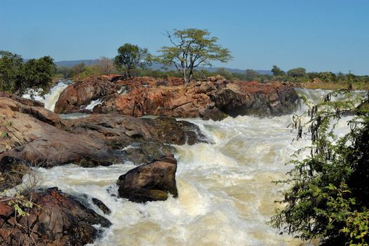                 Top of of the Ruacana waterfalls, Namibia at sunset                