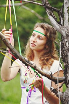 Beautiful girl with ribbons. Early morning photo