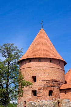 A red tower of Trakaj castle in Lithuania
