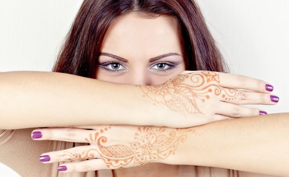 Girl with hands painted Mehandi. Picture by a henna