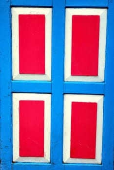 red and blue wooden door