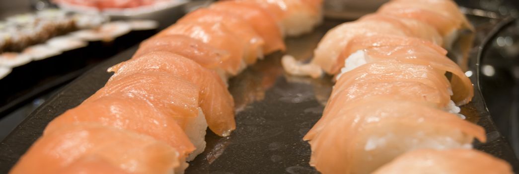 Nigiri-sushi (Nigirizushi) with Salmon at the restaurant
