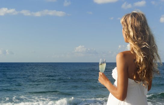 Beautiful woman looking at the sea and relaxing