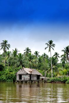 an old house on the banks of the river in rural areas