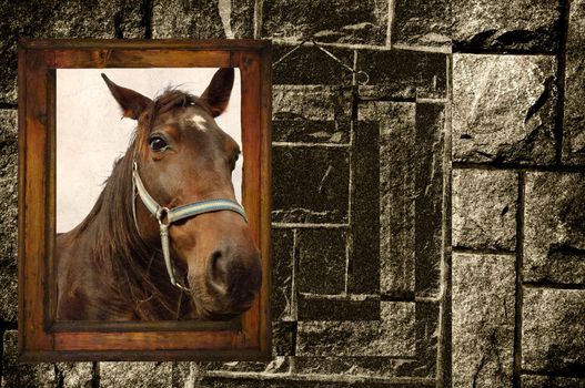 Old wooden frame ,with a horse, in front of an old black and white stonewall.