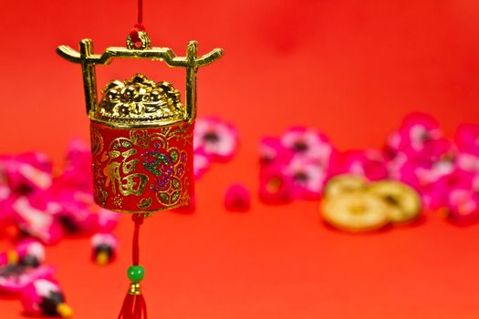 Chinese New Year ornament on red background with cherry blossom for festive using