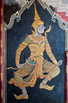 Thai art gold painting on wall  in the Grand Palace Bangkok Thailand