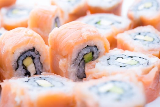 Delicious sushi with salmon, avocado and shrimp